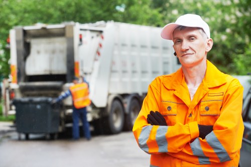 Company van and crew preparing for commercial waste collection